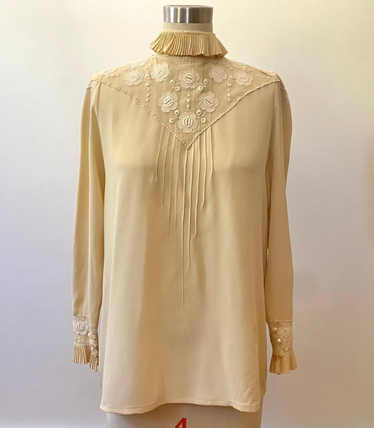 Edwardian style button up top.  Fits like medium.  Bust: 40" | Waist: 38" | Shoulder Width: 36" | Length: 26" | Sleeve Length: 21.5" | Fabric Content: 100% Silk | Era: 1980s | Brand/Maker/Country of Origin: Chloe, Made in France | Condition: Excellent