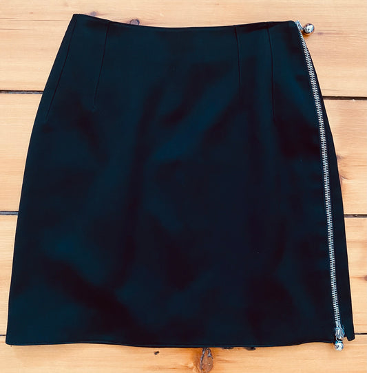 Black, side-zip skirt.  Fits like extra small/small.  Waist: 24" | Hip: 32" | Length: 16.75" | Era: 1980s | Brand/Maker/Country of Origin: Claude Montana, Made in Italy | Condition: Excellent