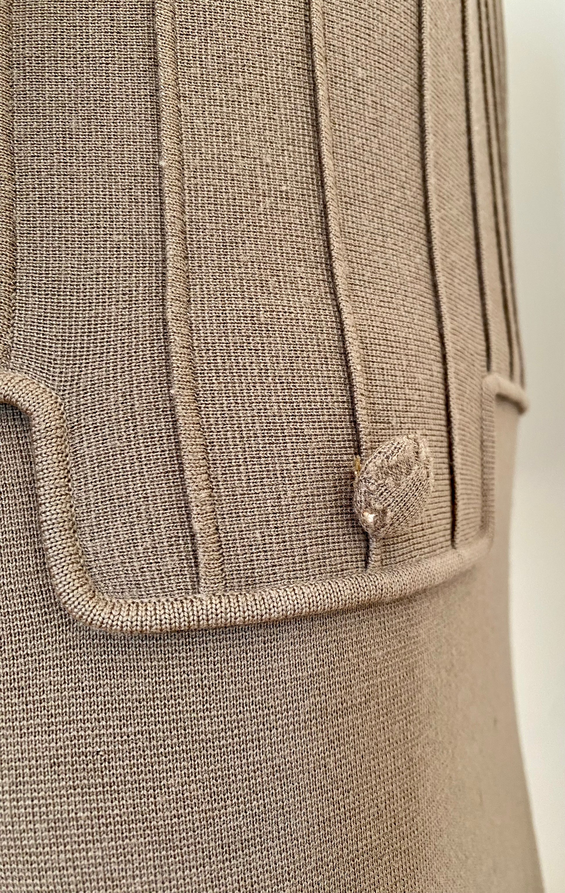 small pin holes throughout garment due to old age.  Some wear shown on fabric buttons.